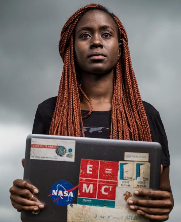 © National Geographic_rights-exempt_5 A woman holding a laptop