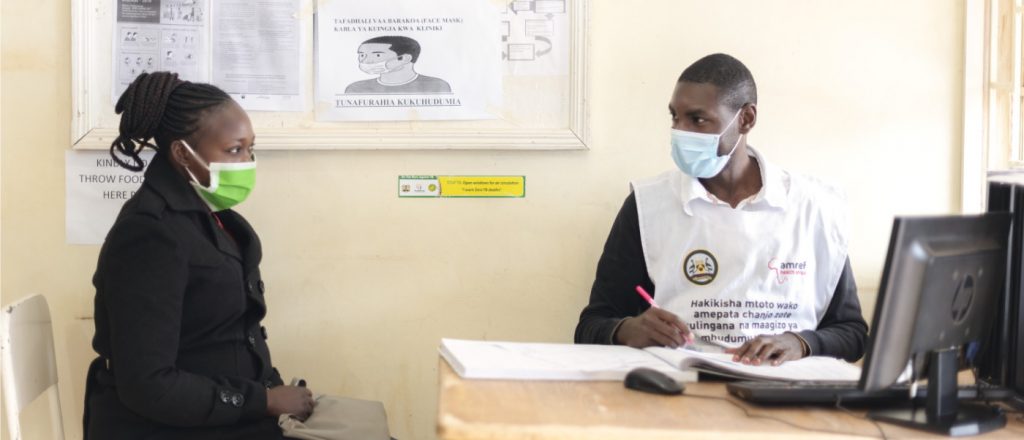 A medical professional meets a patient