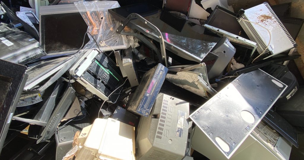 Close up of e-waste in a skip