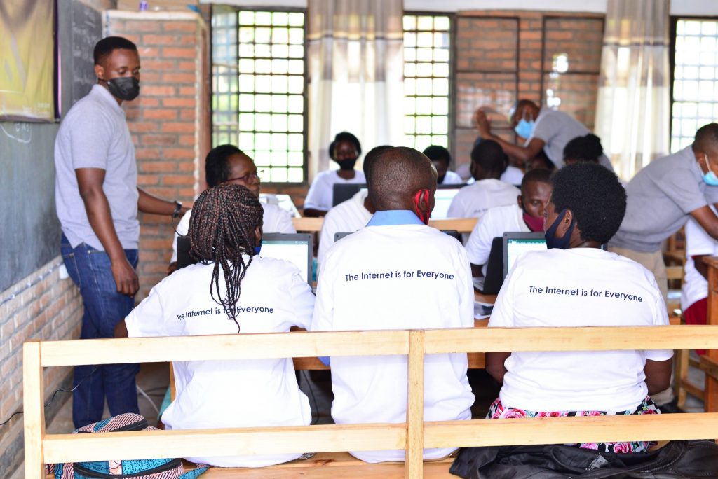 Students in a classroom, wearing The Internet is for Everyone t-shirts