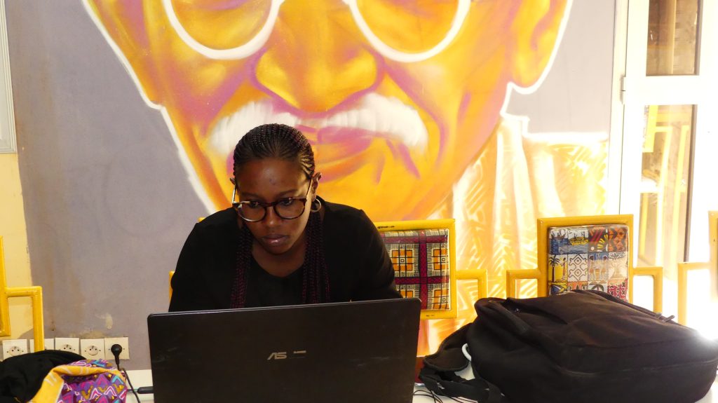 Seated woman in front of laptop