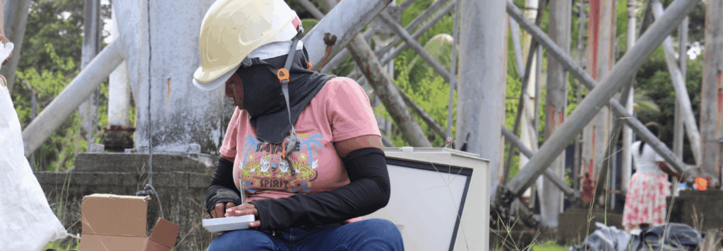 A woman is assembling Internet equipment.