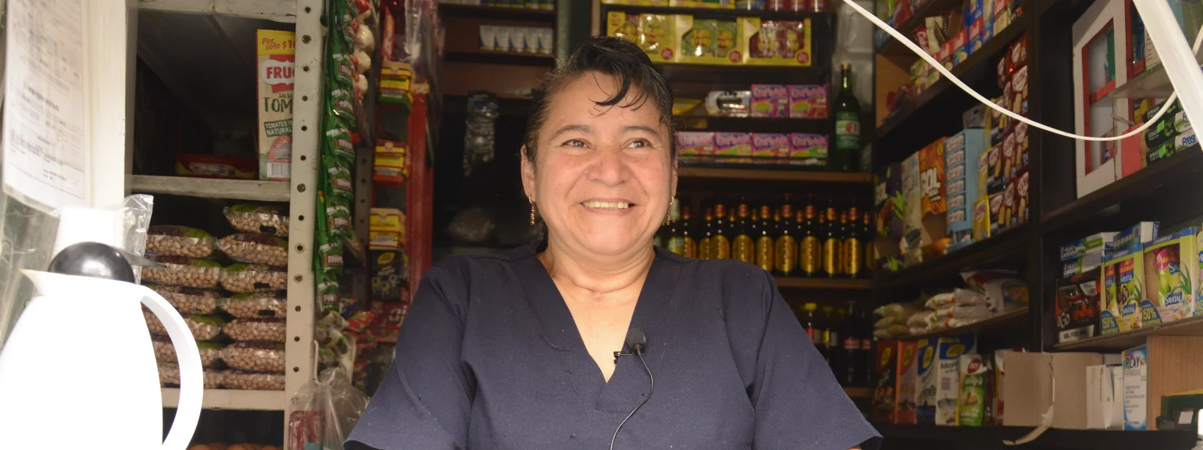 A shopkeeper behind the counter in Colombia