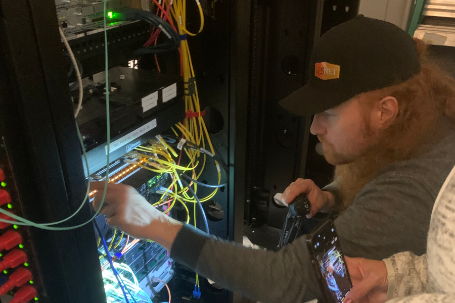 A man is connecting Internet cables.