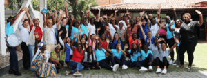 A group of beneficiaries from a grant program is celebrating.