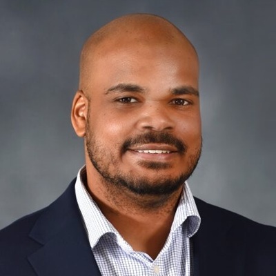 A man in white shirt and black suit.