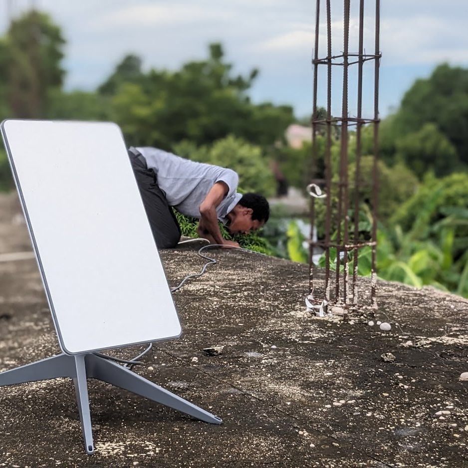 Man installing internet connection antenna