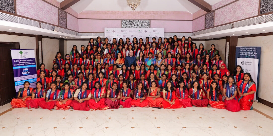 A group of young women wearing red dresses, smiling and posing together