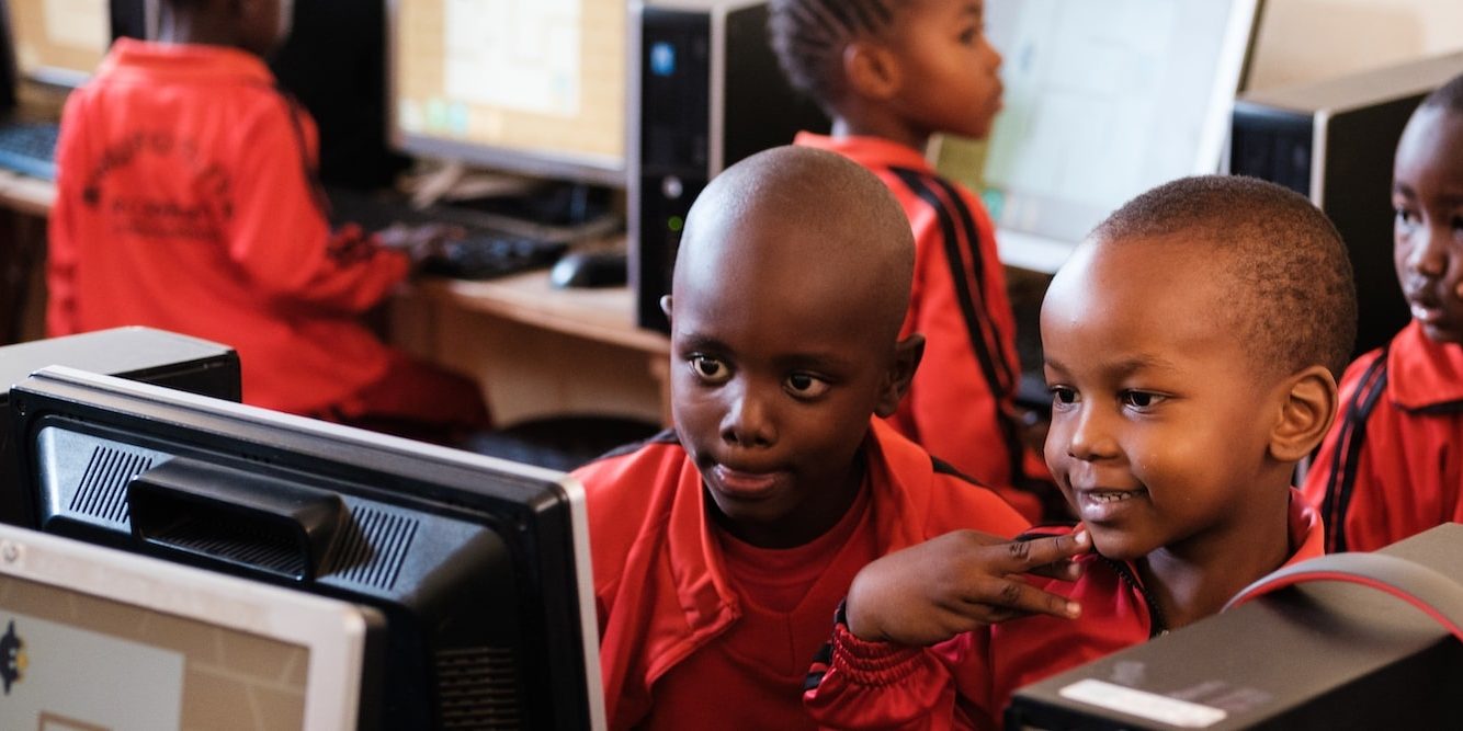 Kids in class using a computer